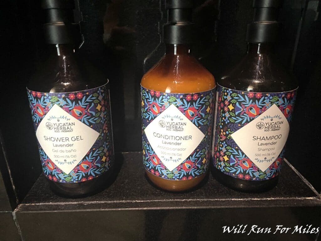 bottles of shampoo and conditioner on a shelf