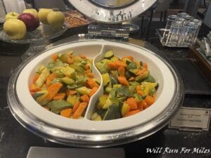 a bowl of vegetables in a buffet