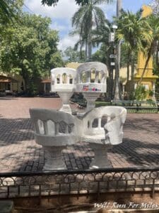 a sculpture of a bench in a park