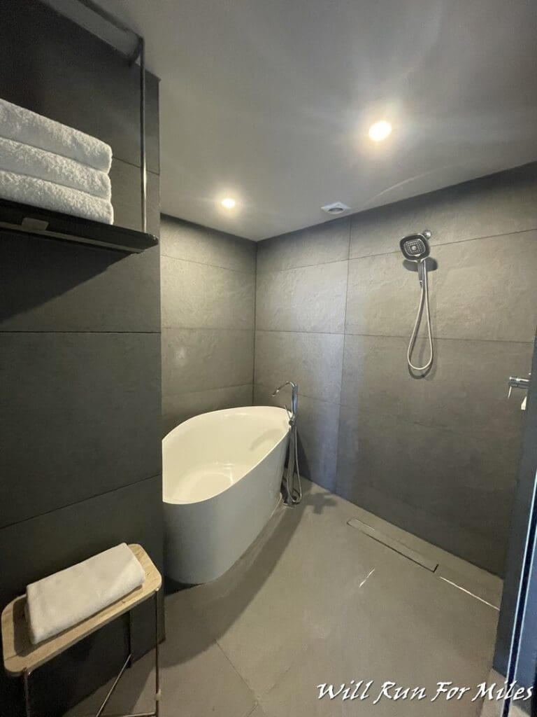 a bathroom with a bathtub and shower