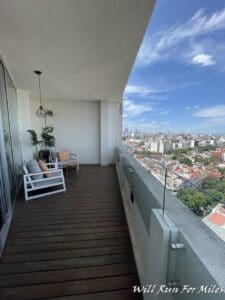 a balcony with a view of a city