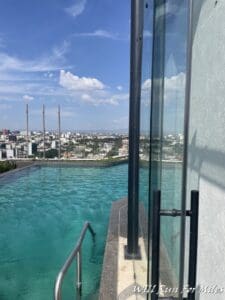 a pool with a city in the background