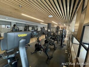 a room with exercise bikes and treadmills