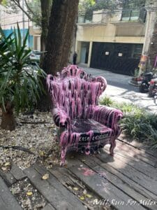 a chair with pink paint on it