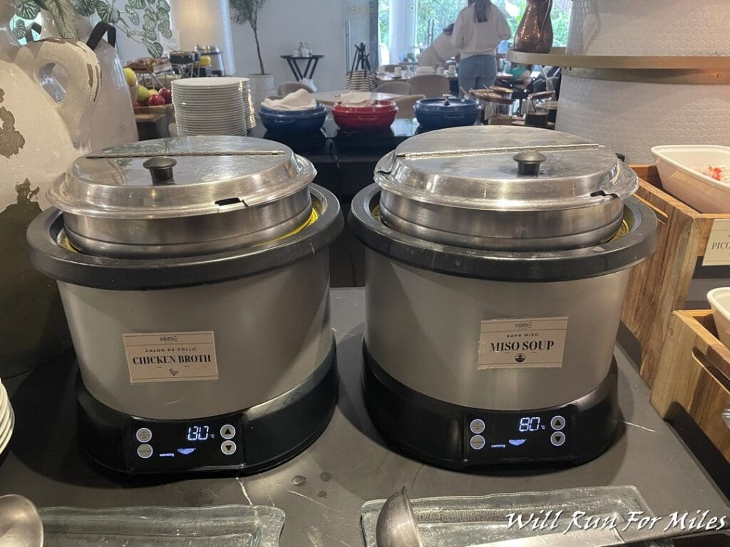 a two large pots with lids on a counter