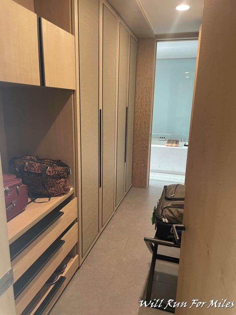 a room with a closet and luggage