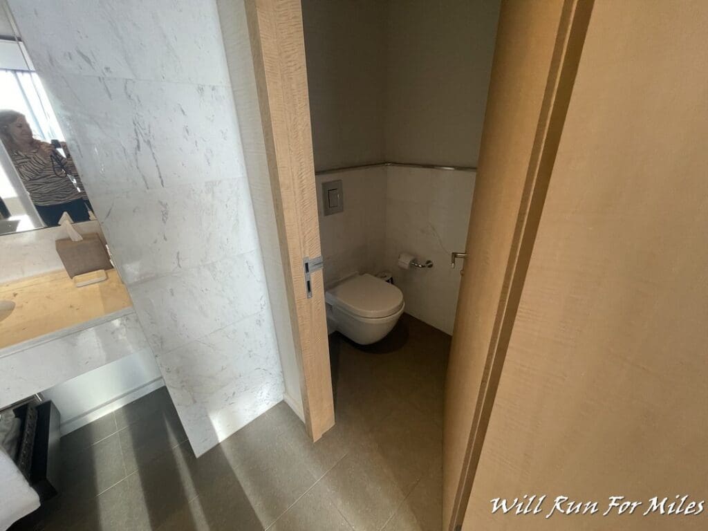 a bathroom with a toilet and a sink