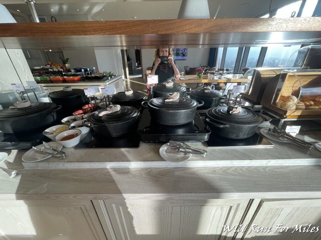 a group of black pots on a counter