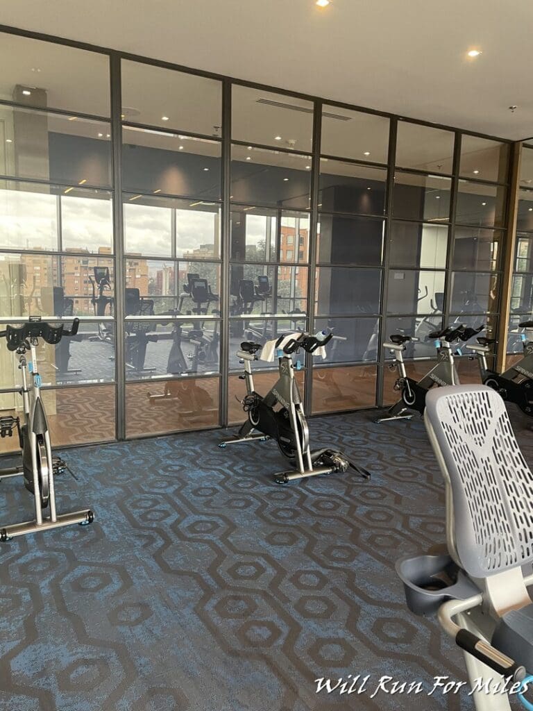 a room with exercise bikes and a window