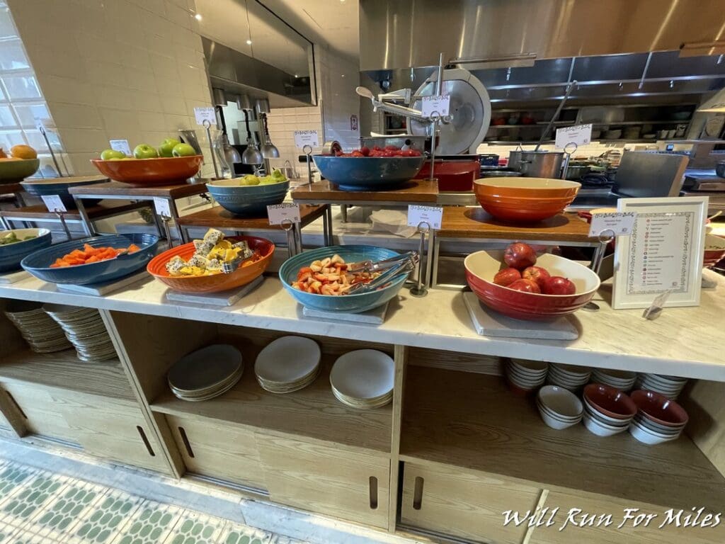 a buffet table with fruit and vegetables