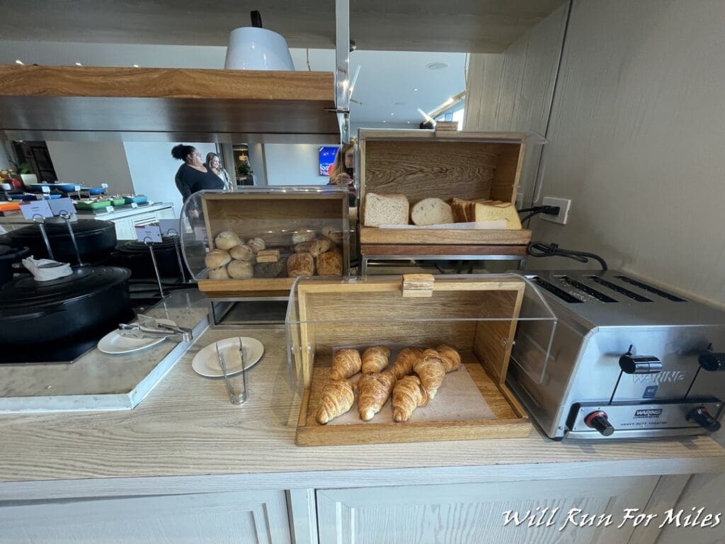 bread and croissants on a counter