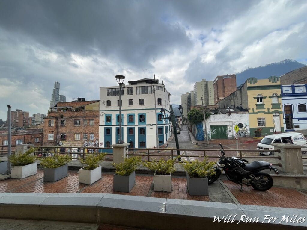 a motorcycle parked on a sidewalk next to a street