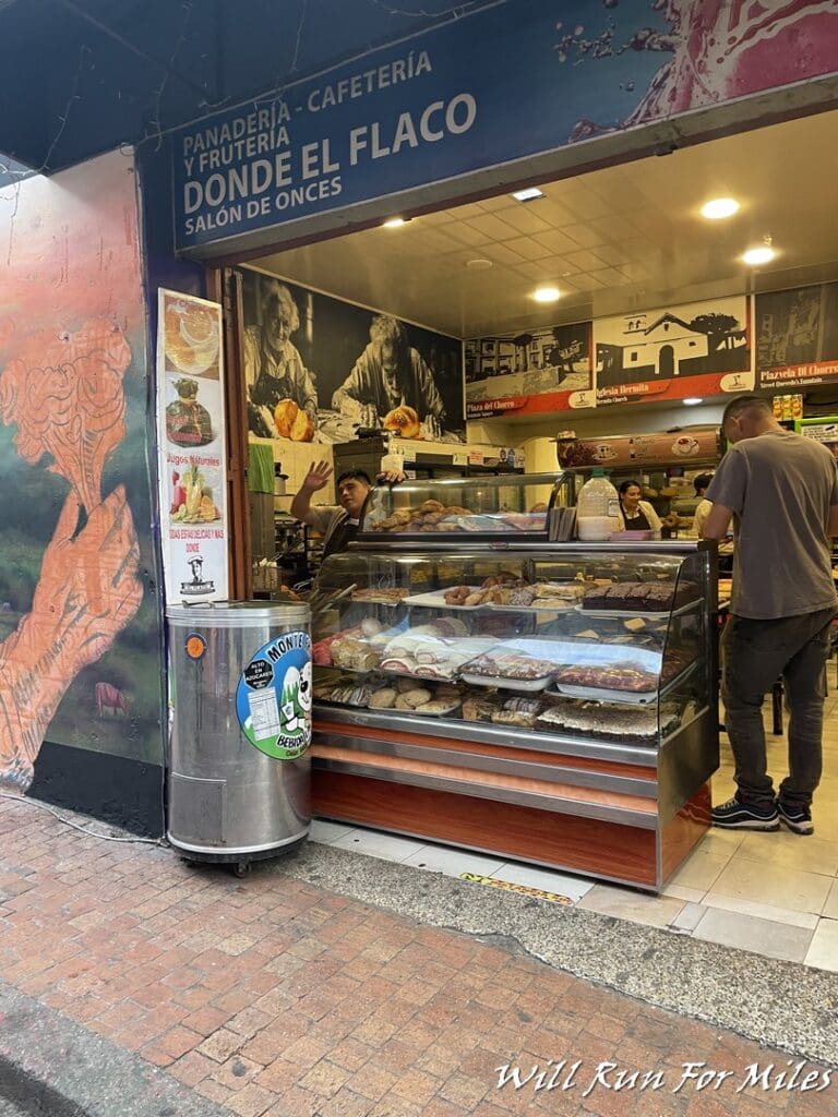 a food store with people standing in front of it