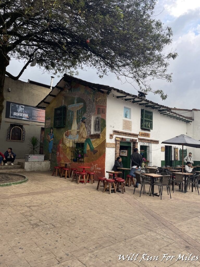 a building with tables and chairs outside