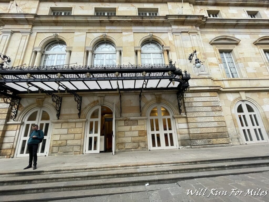 a man standing outside of a building