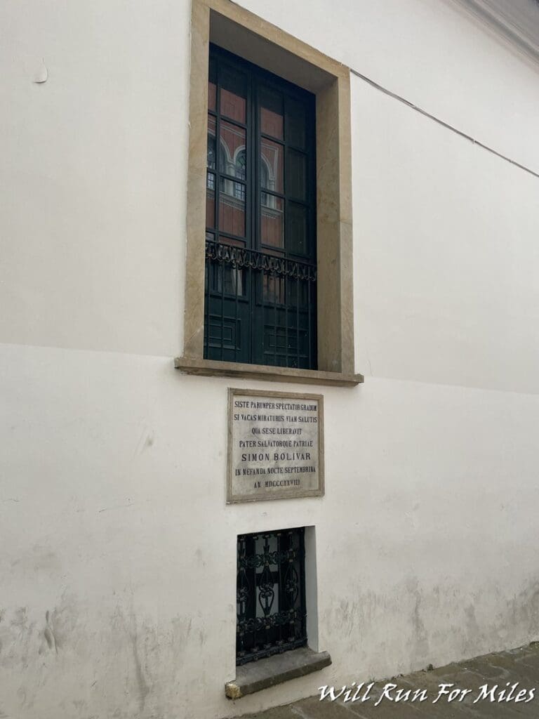 a window with a metal grate on the side of a building