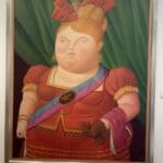 a painting of a woman in a red dress