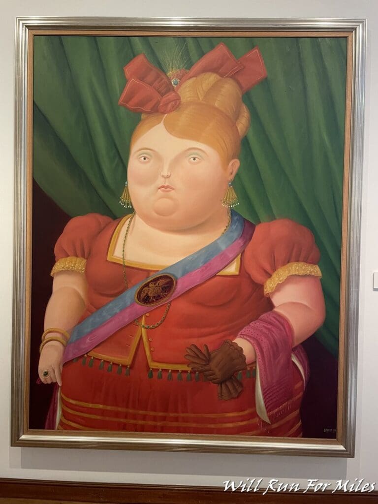 a painting of a woman in a red dress