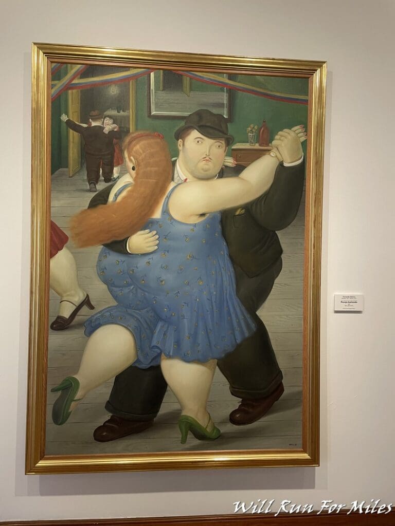 a painting of a man and woman dancing
