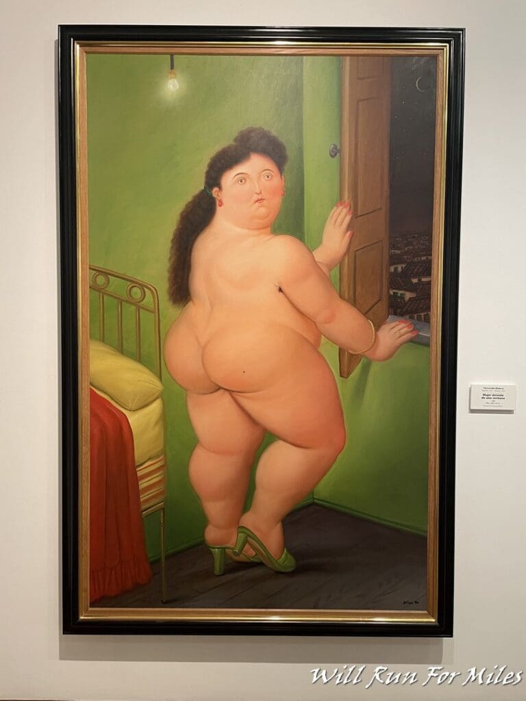 a framed painting of a woman