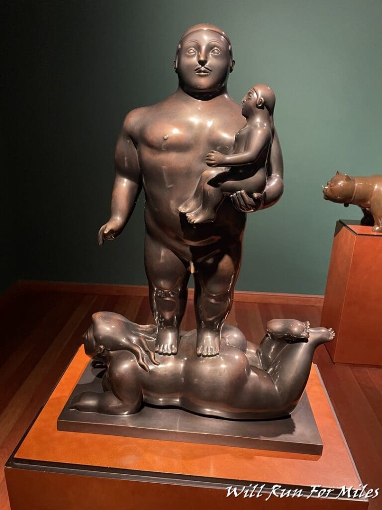 a statue of a man holding a baby