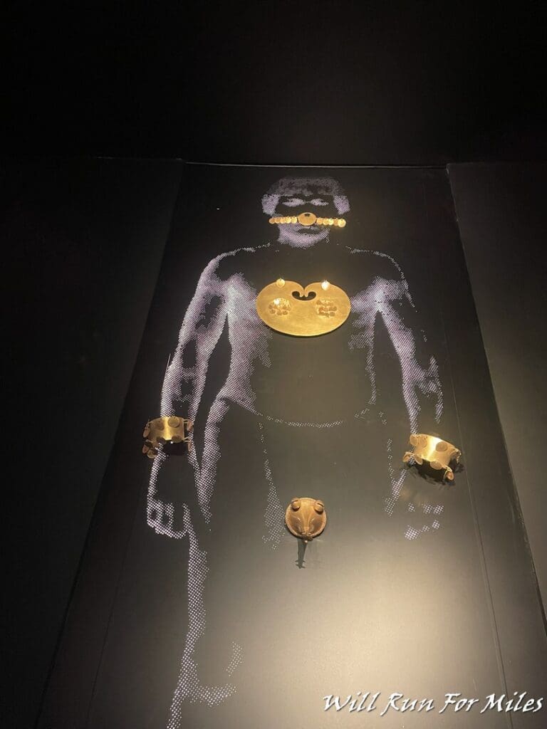 a gold object on a black surface